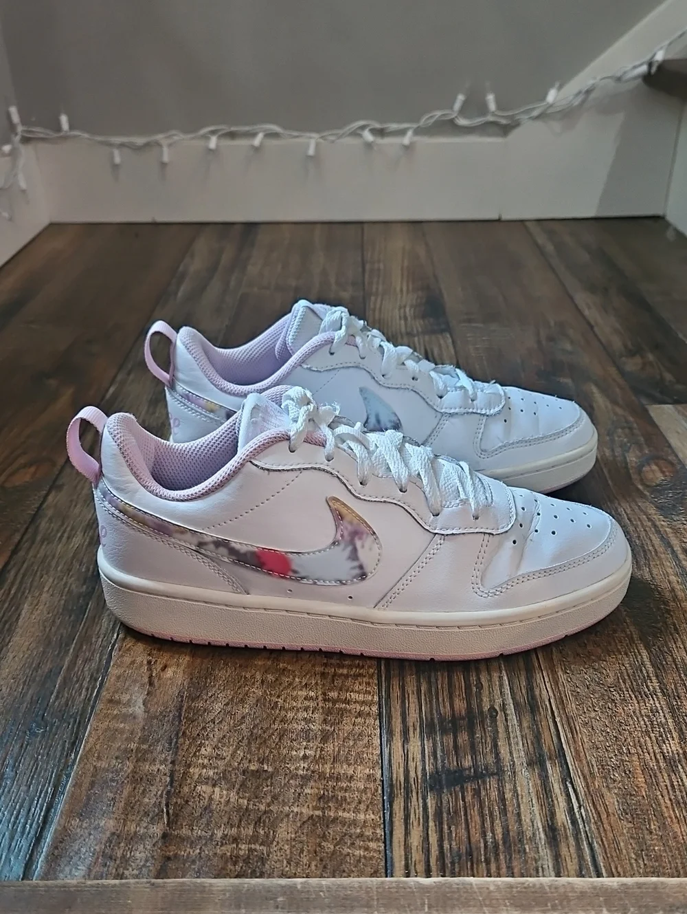 Nike White Low-Top Sneakers with Marbled Swoosh and Pink Details